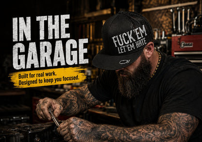 😂🛠️"FUCK EM" LET ’EM HATE Black Snapback Hat – Bold Side Print Mesh Trucker Cap, Flat Bill Streetwear Hat for Men & Women🧢