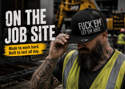 😂🛠️"FUCK EM" LET ’EM HATE Black Snapback Hat – Bold Side Print Mesh Trucker Cap, Flat Bill Streetwear Hat for Men & Women🧢